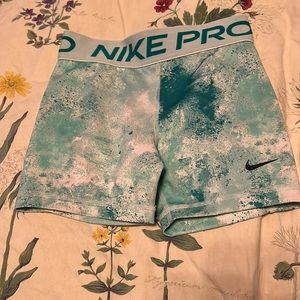 Teal girls medium nike pros.